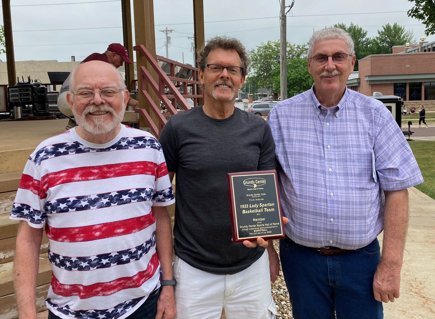Although none of the coaches or members of the 1935 Grundy Center girls basketball team are alive, they were represented by relatives.  Chuck Goodman, Greg Goodman and Paul Harberts represented their mothers at the ceremony. The 1935 Spartan girls finished third in the state.