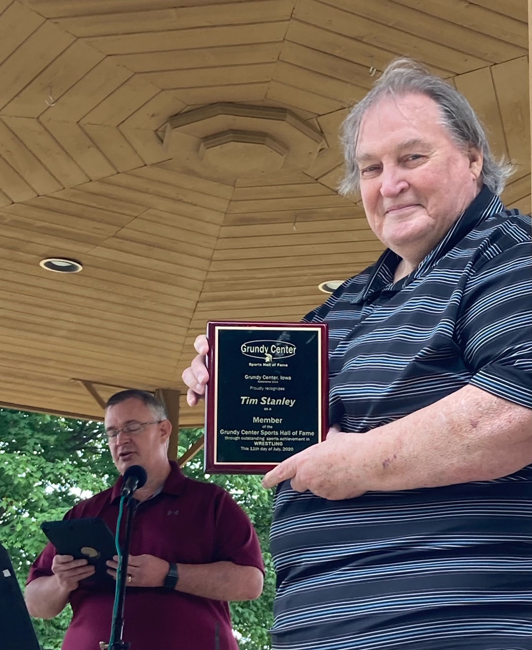 Tim Stanley was honored for his achievement in wrestling with Grundy Center. Doug Van Gelder accepted the award in Stanley’s honor.